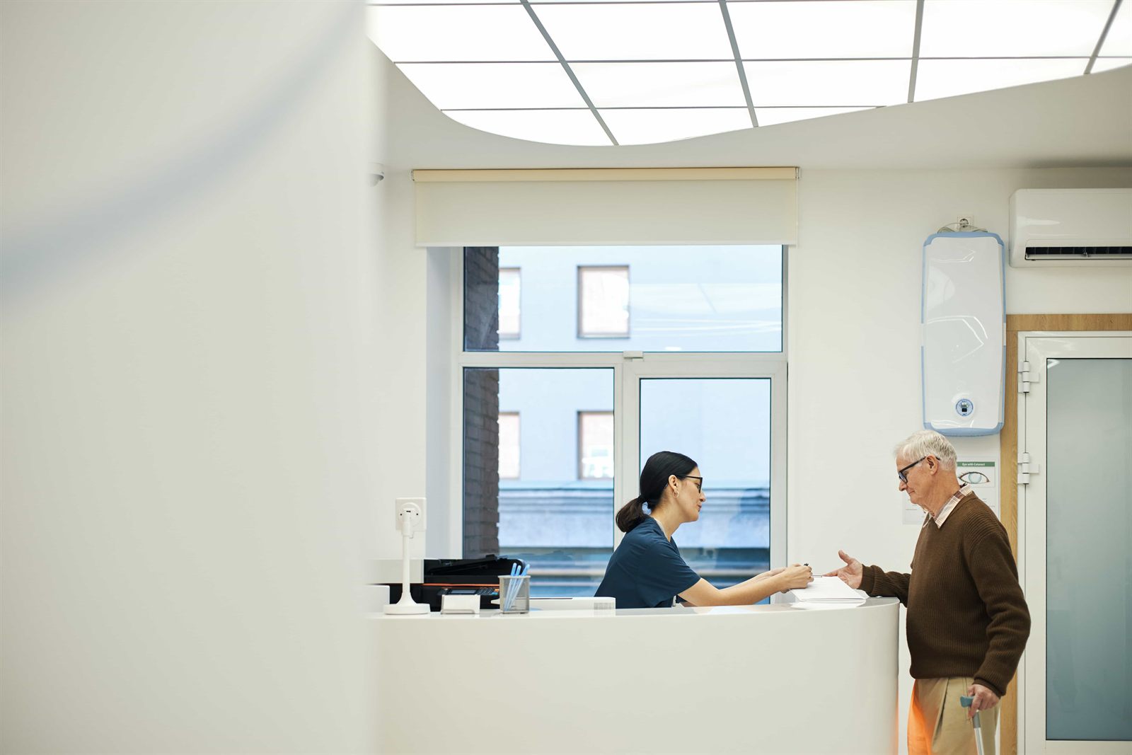 The front desk at Harbourlight Dental, with a patient checking in